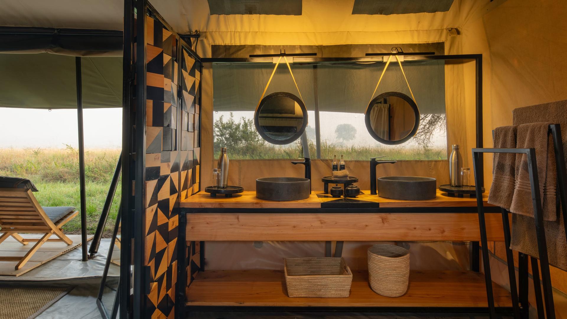 Asilia africa ubuntu migration camp bathroom in family tent
